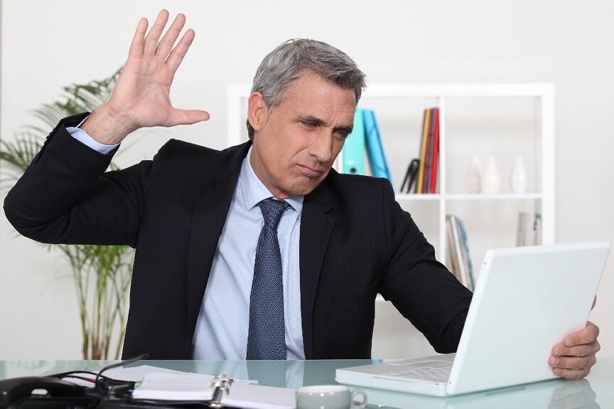 Man getting ready to hit laptop