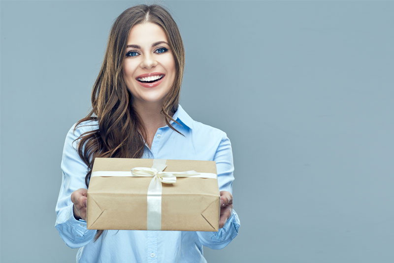 Woman Handing Over a Wrapped Gift