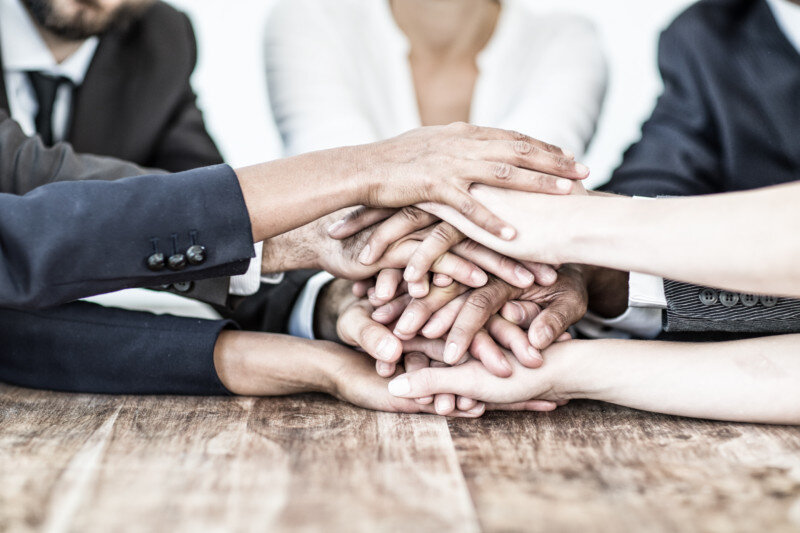 Group of People Holding Hands