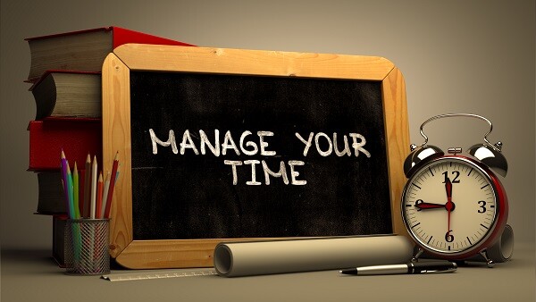 Blackboard with manage your time written on it