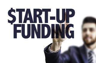 Man writing start-up funding