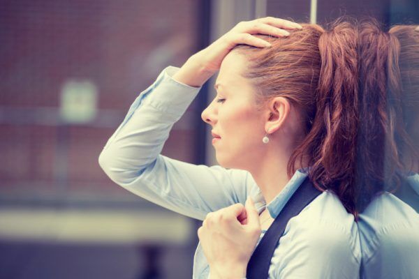 portrait stressed sad young woman outdoors. Urban life style stress