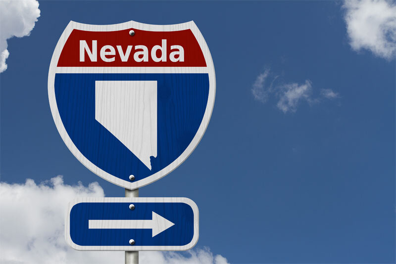Highway Sign With Nevada Name and State Map