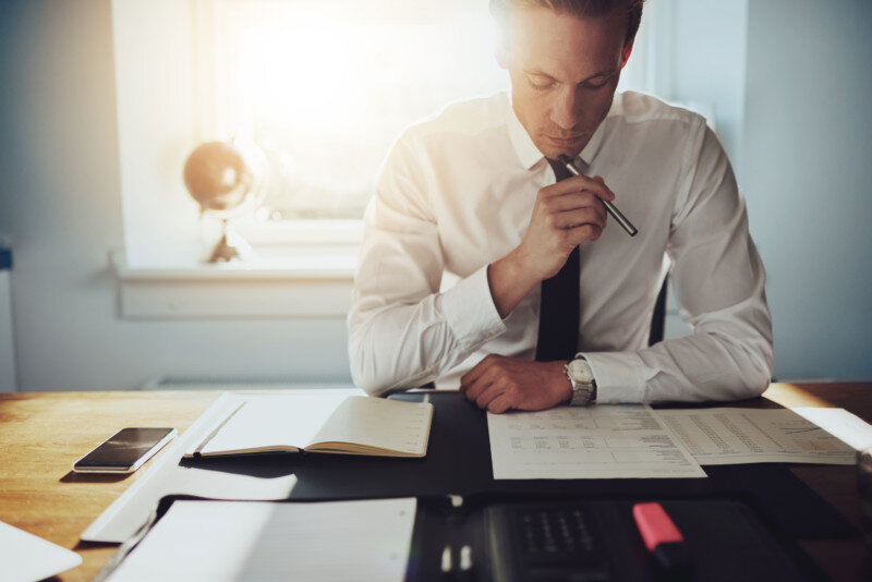 Serious business man working on documents