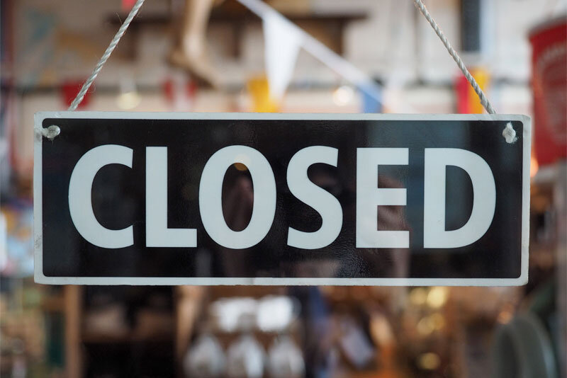 Closed Sign on Business Window