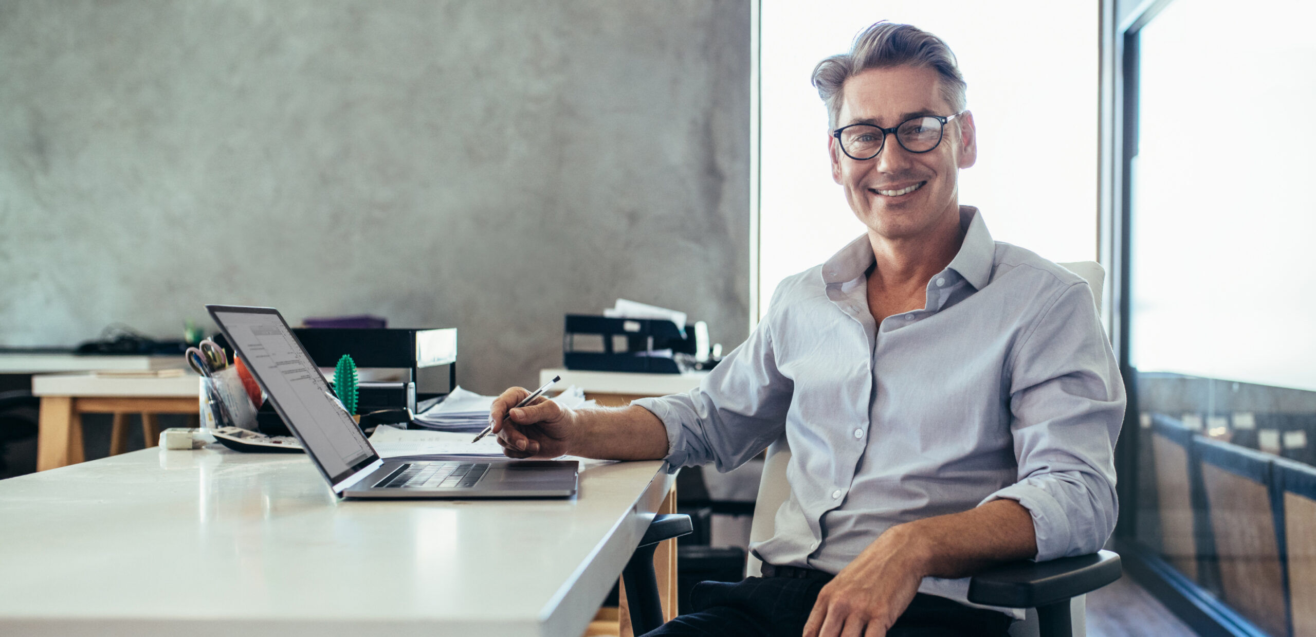 Man With Glasses at Computer