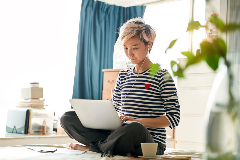 Young Asian Woman Working on Laptop