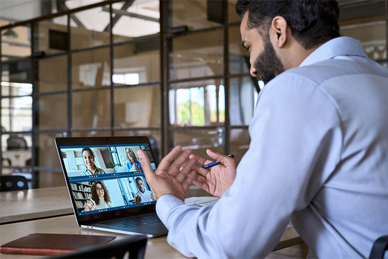 Businessman Talking to Staff on Zoom